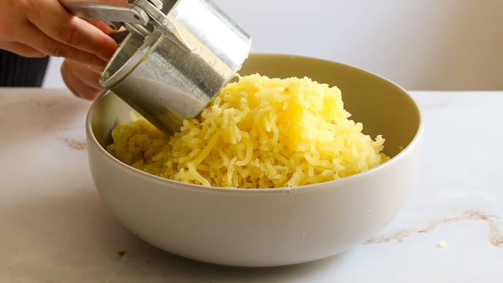 schiacciare patate